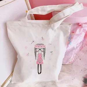 Close-up detail view of the cute cartoon printed canvas tote bag showcasing fine fabric.