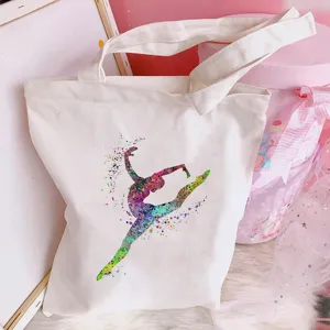 Detail view of white canvas tote bag featuring colorful watercolor ballet dancer art for daily use.