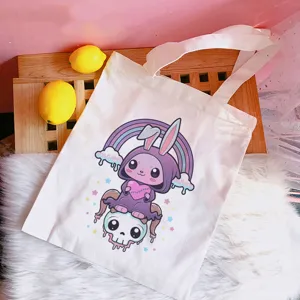 Cute pastel goth canvas tote bag with cartoon creature print, casual shoulder bag for women.