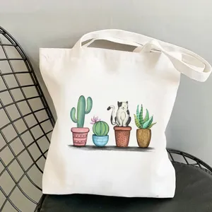 Borsa in tela con stampa di gatto e cactus, ideale per l'uso quotidiano e lo shopping studentesco.