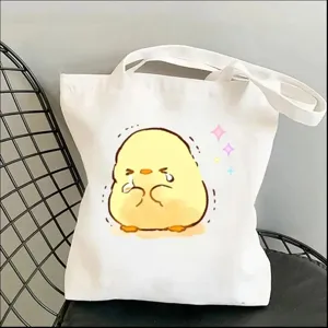 Cute yellow duck canvas tote bag for women, stylish casual shoulder handbag with cartoon print.