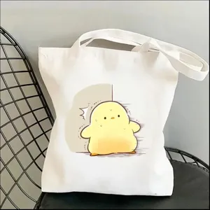Cute cartoon yellow duck canvas tote bag for women, casual shopping shoulder handbag.