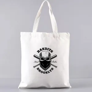 Weisse Segeltuchtasche mit coolem Totenkopf Grafik Print, laessige taegliche Freizeittasche.