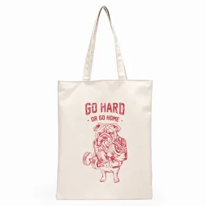Close-up detail of the canvas tote bag featuring a bulldog fitness print and motivational quote.