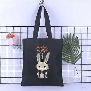 Black canvas tote bag with cute cartoon rabbit print, casual Harajuku style shoulder bag.