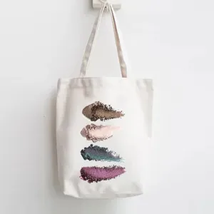 Canvas tote bag featuring colorful eyeshadow swatch print, casual daily shoulder bag design.