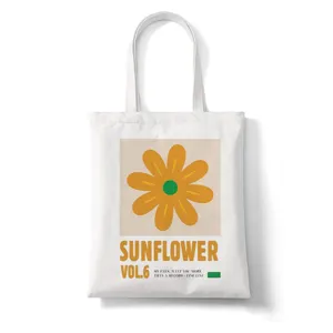 Witte canvas shopper tas met esthetische zonnebloem print en typografie voor dagelijks gebruik.