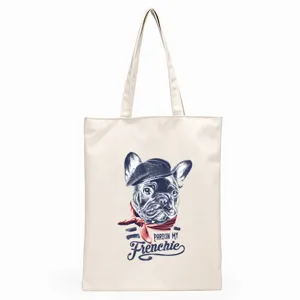 Detailed view of canvas tote bag with cute French bulldog print and stylish text design.