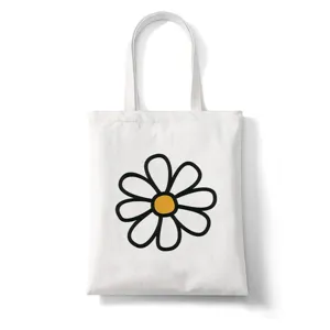 Gedetailleerd overzicht van de witte canvas draagtas met leuke zwart-gele madeliefjesprint.