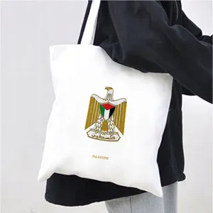 White canvas tote bag with Palestine eagle print, casual shoulder bag for daily shopping.