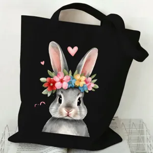 Casual black canvas tote bag featuring a cute rabbit flower crown print, perfect for daily commuting.