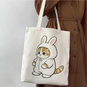 Vista detallada del bolso tote de lona blanca con lindo diseño de gato para uso diario.