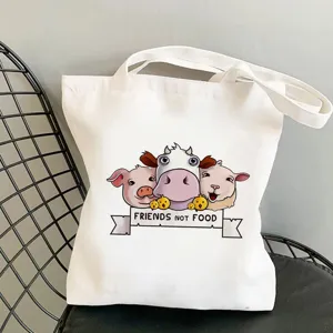 Detailaufnahme der niedlichen bedruckten weißen Leinen-Tragetasche mit Tiermotiv Slogan.