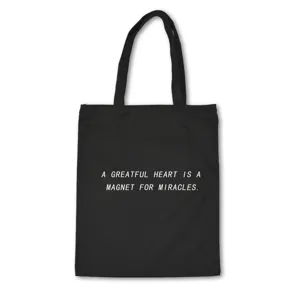 Black canvas tote bag with inspirational quote print, casual reusable shoulder shopping bag.