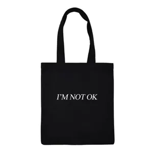 Black canvas tote bag detail view, featuring simple quote print design for daily casual wear.