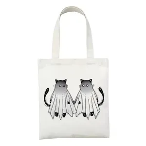 Detail van de witte canvas shopper schoudertas met schattige spookkatten print voor dagelijks.