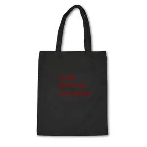 Detailed view of the black canvas tote bag featuring motivational quote print for daily casual use.