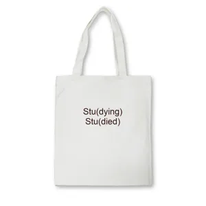 Minimalist white canvas tote bag featuring witty graphic text printing, ideal for daily student use.