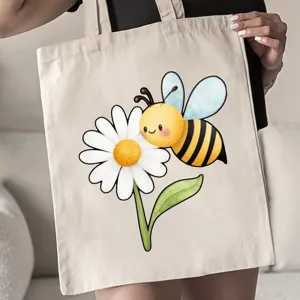 Vista detallada del bonito estampado de abeja y margarita en el práctico bolso de lona.