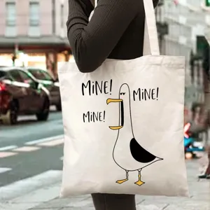 Detailed view of casual canvas tote bag with funny seagull print and cute design.