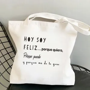 Weißer Canvas Shopper mit spanischem Zitat Print, lässige Umhängetasche für den Alltag.