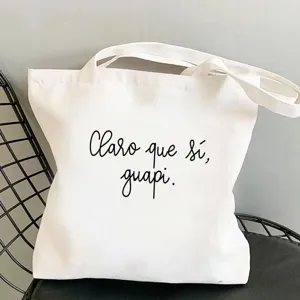 Weisse Segeltuchtasche mit spanischem Spruch Print, laessige Schultertasche fuer den Alltag.