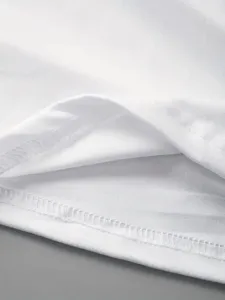 Detailed view of women's white short sleeve t-shirt fabric and neat hem stitching craftsmanship.