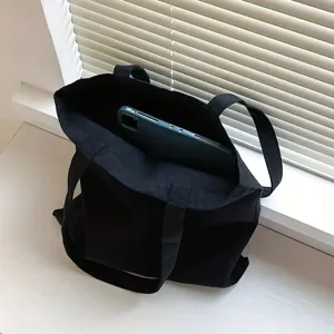 Zwarte canvas shopper tas voor dagelijks winkelen, reizen en studenten met stijl.