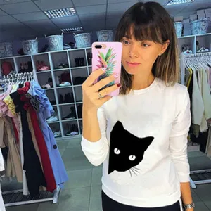 White long sleeve t-shirt featuring a cute black cat print detail for women casual wear.