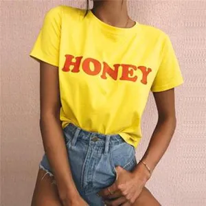 Yellow short-sleeve T-shirt with red letter print and casual blue denim shorts outfit.