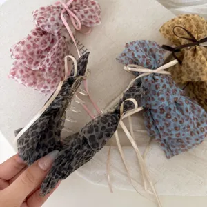 Chic leopard mesh hair claw clip with ribbon bow, elegant fashion hair accessory for women.