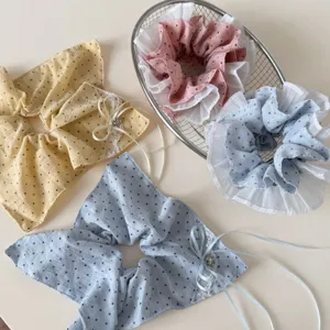 Polka dot hair scrunchies with ribbon bows, sweet style hair accessories and cute pony tail holders.