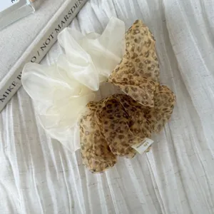 Korean style mesh scrunchies detail, featuring a white and a leopard print hair accessory.