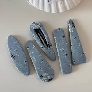 Blue fabric floral hair clips set, cute geometric hair pins and styling barrettes for daily wear detail.
