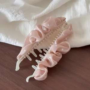 Pink heart polka dot fabric hair claw clip detail shot showcasing the elegant claw teeth.