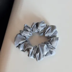 Grey plaid hair scrunchie detail showcase, soft fabric hair tie for cute daily wear and styling.
