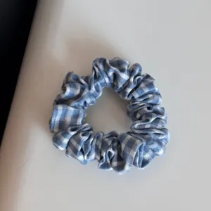 Blue and white gingham hair scrunchie fabric hair tie cute daily hair accessory detail view.