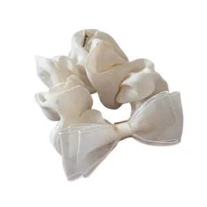 Elegant white organza hair scrunchie with bow and heart pattern, perfect for daily styling.