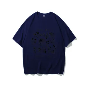 Close-up detail of the botanical print and environmental slogan on the navy blue t-shirt.