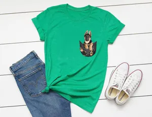 Green graphic t-shirt featuring a cute German Shepherd puppy print, styled flat lay detail.