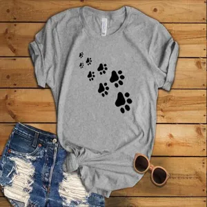 Casual grey short sleeve t-shirt for women featuring cute black animal paw print graphic.