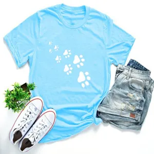 Detailed view of light blue short sleeve t-shirt featuring cute white paw prints design.