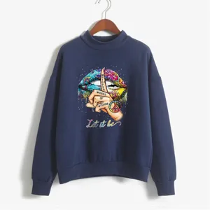 Detailed view of the dark blue mock-neck sweatshirt featuring a colorful graphic art print.