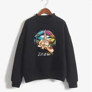 Close-up detail of women's black high-neck sweatshirt with colorful artistic lip print.