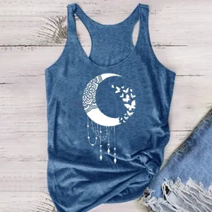 Detailed view of the blue moon print tank top on rustic wood background, casual design.