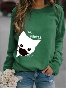 Felpa verde da donna con simpatico motivo di gatto e stampa grafica con maschera.