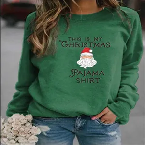 Green Christmas crewneck sweatshirt featuring festive Santa graphic and fun text print.