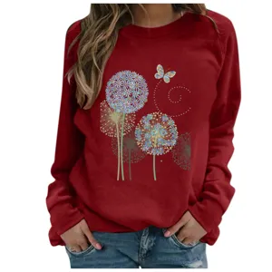 Detailed view of the dandelion print on the women's long sleeve wine red sweatshirt.