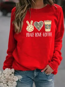 Close-up detail of women's red crewneck sweatshirt featuring trendy leopard print graphic.