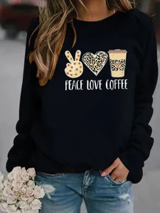 Close-up detail of the graphic printed black long-sleeve sweatshirt with leopard design.